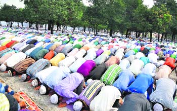 People pray at Eidgah on the occasion of Eid in Dehradun on Monday.