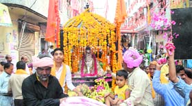 devotional outpouring: Bhagwan Valmiki Milap Sabha members participate in a Shobha Yatra on the eve of Bhagwan Valmiki Jayanti in Amritsar on Tuesday.