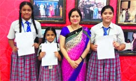 DAV International School principal Anjana Gupta congratulates students whose entries were selected for CBSEs Swachh Bharat Expression Series in Amritsar.