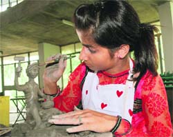 A student of fine arts exhibits her talent in the clay modelling competition during the Zonal Youth Festival that began at Guru Nanak Dev University in Amritsar on Tuesday.