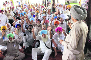 Members of the PRTC Pensioners Association protest in Bathinda on Tuesday.