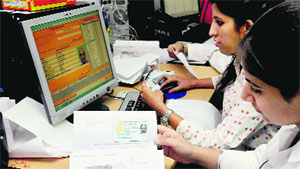 Staff of the Registration and Licensing Authority dispatch registration documents and driving licences at the RLA office in Sector 17, Chandigarh.