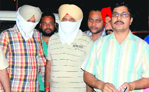 The accused in police custody in Mohali on Tuesday. 