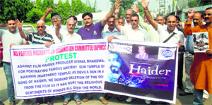 Members of the All Parties Migrants Coordination Committee protest against a song in Haider in Jammu on Tuesday.