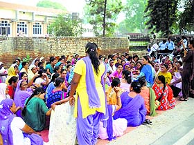 Anganwari workers protest outside the office of Deputy Commissioner in Fazilka on Tuesday.