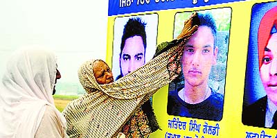 hoardings of youths allegedly killed in fake encounters. 
