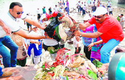 Volunteers clean a Ganga ghat as part of a cleanliness drive in Haridwar on Tuesday. Tribune photo