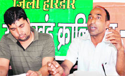 Uday Ram Semwal, secretary of the UKD-Progressive labour cell, (right) with youth wing city president Lalit Mamgain in Haridwar on Tuesday. Tribune photo