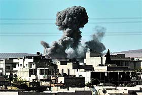 Smoke rises after an airstrike in Kobani as fighting intensified between Syrian Kurds and the militants of Islamic State.