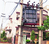 A newly installed transformer in New Amritsar ( Block A) which has tilted on the side posing a risk to the commuters passing through the adjoining road in Amritsar. 