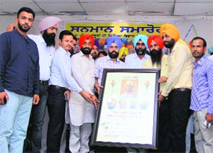 ETT teachers present a memento to Zila Parishad chairman Gurpreet Singh Maluka at a function in Bathinda on Wednesday