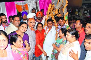 BJP candidate Gian Chand Gupta at the Mansa Devi market. 