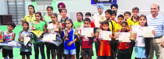 Winners of the Shivalik Badminton Trophy in a jubilant mood at Phase VI in Mohali on Wednesday