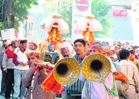 The palanquins of local deities being carried by villagers during the International Dasehra Festival in Kullu