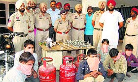 Policemen along with the six nabbed thieves and recovered stolen articles in Jalandhar on Wednesday
