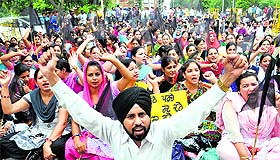 Workers of the Computer Teachers Union protest in Jalandhar on Wednesday. 