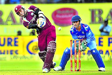 Marlon Samuels plays a shot against India during their first ODI match at the Jawaharlal Nehru Stadium in Kochi on Wednesday.