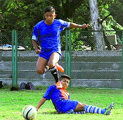 Players try to take control of the ball in a match in the Lala Nemidass Memorial District Football League played at Pavilion Ground in Dehradun on Wednesday.
