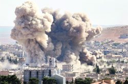 Smoke rises after a US-led air strike in the Syrian town of Kobani on Wednesday. Reuters