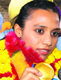 Asian Games gold medallist Mandeep Kaur is welcomed at Amritsar railway station on Thursday. Tribune photo