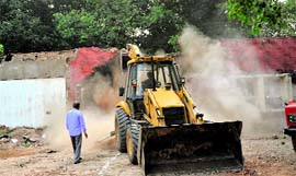 A file photo of the Sector 18 structure being demolished to raise a multi-storeyed building that will house offices of Punjab, Haryana and Chandigarh. The demolition was carried out on October 7.