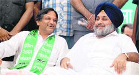 Sukhbir Singh Badal, Dy CM, Punjab, and Kulbhushan Goyal, INLD candidate from Panchkula, in a jubilant mood during a rally in Panchkula on Thursday.