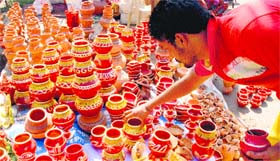 Sacred red: A vendor arranges pots ahead of Karva Chauth at Sector 7, Panchkula, on Thursday.
