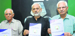 General secretary of the Haryana Insaaf Society DR Chaudhry (left) along with other members releases the 'People's manifesto' in Chandigarh on Thursday.
