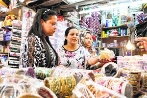Women buy bangles for the Karva-Chauth festival in Dharamsala on Thursday.