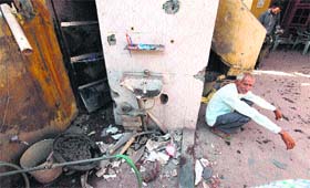 DEVASTATED: A man sits in his house damaged in Pakistani shelling in Nanga village of Samba district on Thursday.