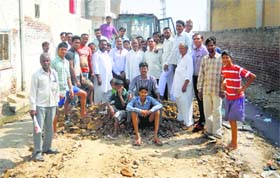 Residents rejoice the reconstruction of a damaged road in Abohar on Thursday