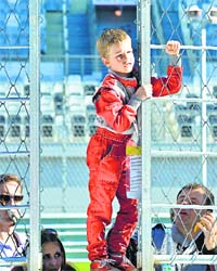 A boy looks at the track at the F1 Autodrom in Sochi ahead of the Russian Formula One Grand Prix