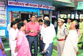 District Magistrate D Senthyl Pendiyan and Circle Officer Chandra Mohan inquire about the affairs of the Shri Mansa Devi Mandir Trust in Haridwar