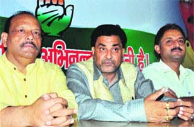 Uttarakhand Congress in charge Sanjay Kapoor addresses a press conference at the party office in Dehradun on Thursday