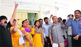 Councillors protest outside the Mukhya Nagar Adhikaris office in Dehradun on Thursday