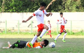 A player of Garhwal Sporting Football Club moves the ball towards the goal during a match in the Nemidass District Football League in Dehradun on Thursday