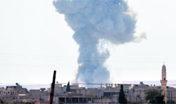 Smoke rises after an US-led air strike in Kobani on Thursday. Reuters