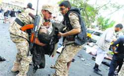 Shiite Houthi rebels carry a body after a suicide attack in Sanaa on Thursday. Reuters