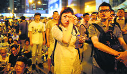 A demonstrator cries during a speech after the government cancelled talks in Hong Kong on Thursday. Reuters