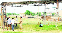 Workers set up sample kiosks at the temporary firecracker market in Amritsar. A Tribune photograph