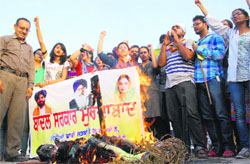 Students of Chintpurni Medical College burn an effigy of MP Harsimrat Kaur Badal in Amritsar on Friday. PHOTO: RK SONI