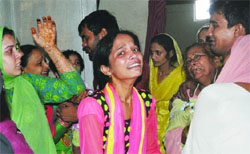 Relatives grieve over the loss of five lives in a cylinder blast in southeast Delhi's Jasola area on Friday. tribune Photo
