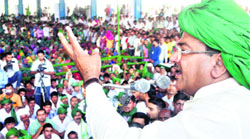 INLD leader Abhay Chautala addresses a rally at Meham in Rohtak on Friday. 