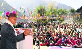 Chief Minister Virbhadra Singh addresses a public at Pooh in Kinnaur district on Friday.