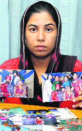 Rajwinder Kaur, deserted wife of an NRI, shows photograph of her marriage. 