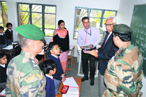 Governor NN Vohra and GoC of Srinagar-based 15 Corps Lt General Subrata Saha during a visit to the Army Public School in Srinagar on Friday.