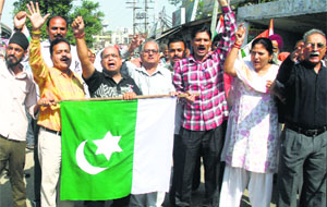 Activists of the Jammu Pragti Manch protest in Jammu on Friday.