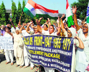 Members of the PoJK Refugee Front protest in Jammu on Friday.
