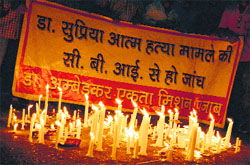 Protesters hold a candlelight protest against police inaction in Dr Supriya sucide case in Ludhiana on Friday. Photo: Inderjeet Verma