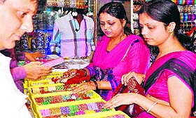 Ahead of Karwa Chauth, women select bangles at Jwalapur in Haridwar on Friday. tribune photo: